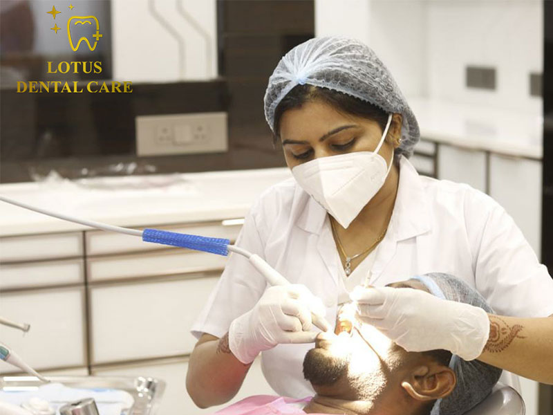 Dr. Sonal Agrawal examining and treating dental problems with precision and care at Lotus Dental Care Clinic, Best Dental Clinic in Vashi, Navi Mumbai